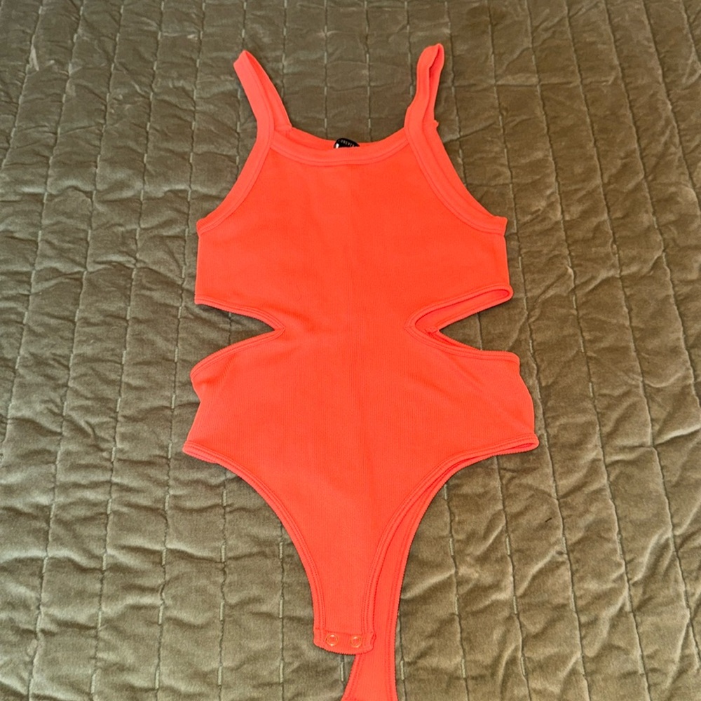 Coral/orange body suit with cutouts